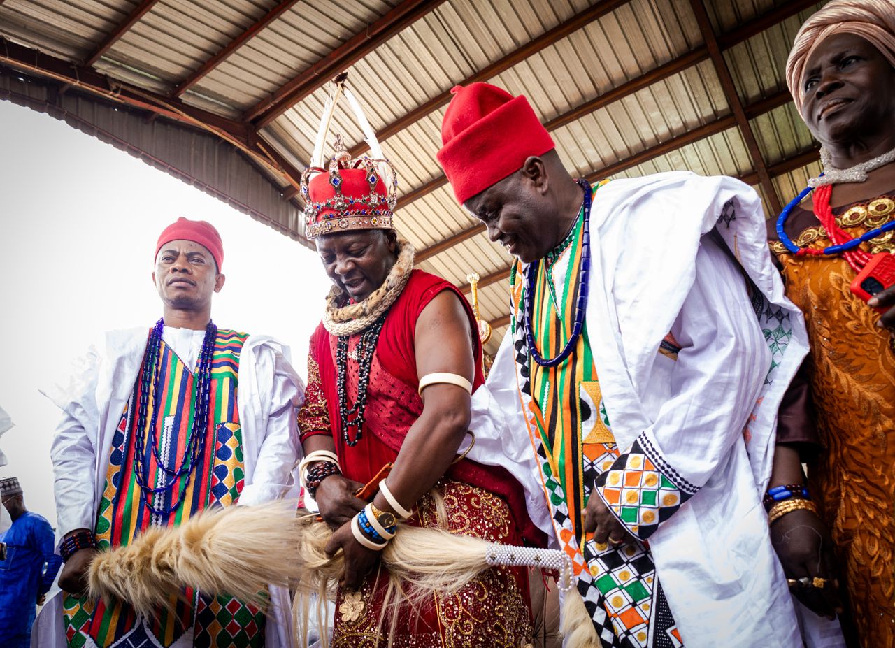 About A vibrant traditional ceremony in Nigeria featuring chiefs in colorful attire, celebrating cultural heritage.