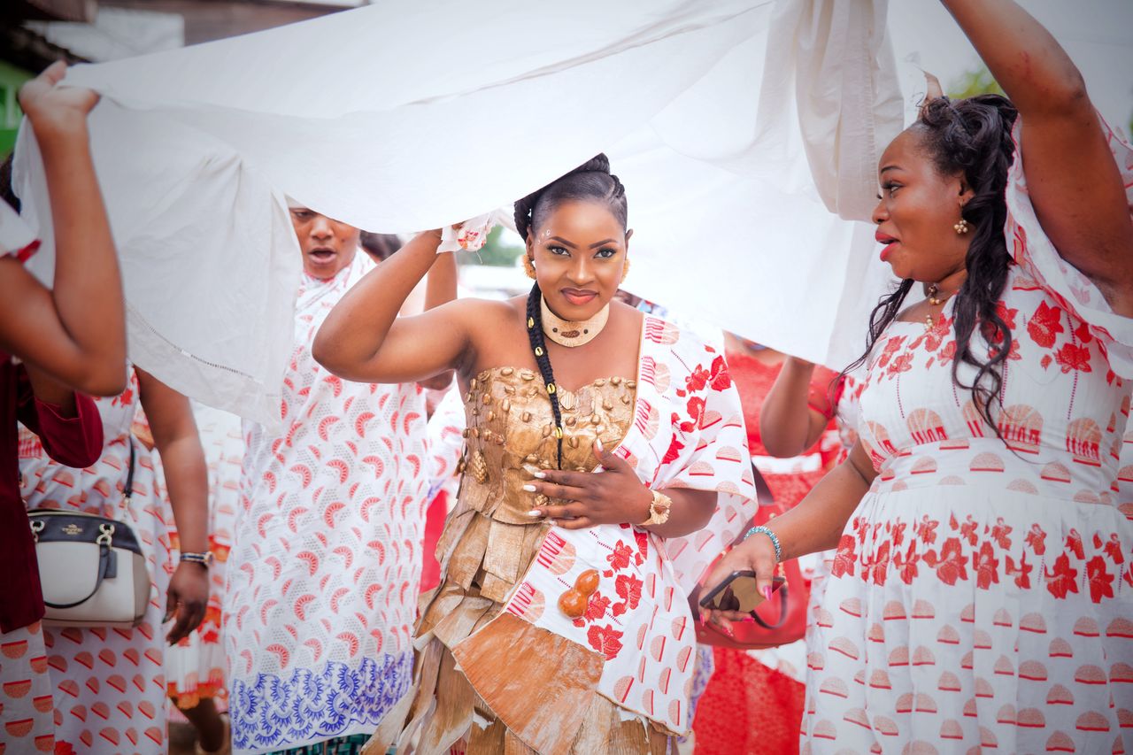 Services A lively traditional ceremony featuring women in colorful attire, celebrating with joy and cultural pride.